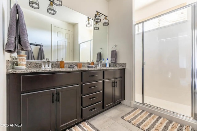 2465 W Clement Cir, Flagstaff, AZ 86001 - bathroom with a stall shower, double vanity, and tile patterned flooring