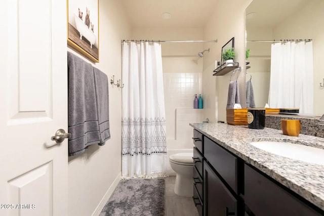 2465 W Clement Cir, Flagstaff, AZ 86001 - bathroom with vanity, toilet, shower / tub combo with curtain, baseboards, and tile patterned flooring