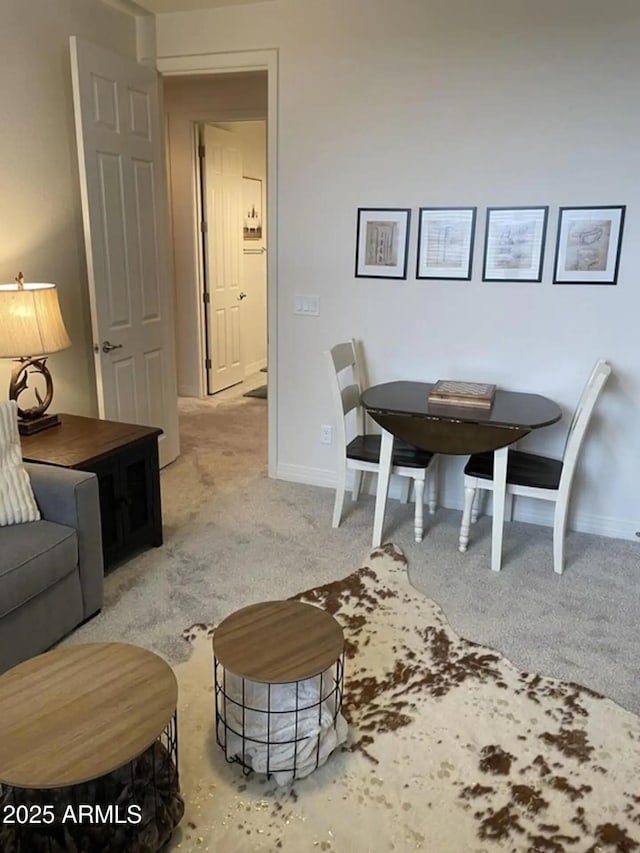 2465 W Clement Cir, Flagstaff, AZ 86001 - carpeted dining space featuring baseboards
