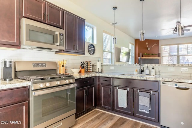 2465 W Clement Cir, Flagstaff, AZ 86001 - kitchen featuring appliances with stainless steel finishes, a sink, ceiling fan, and plenty of natural light