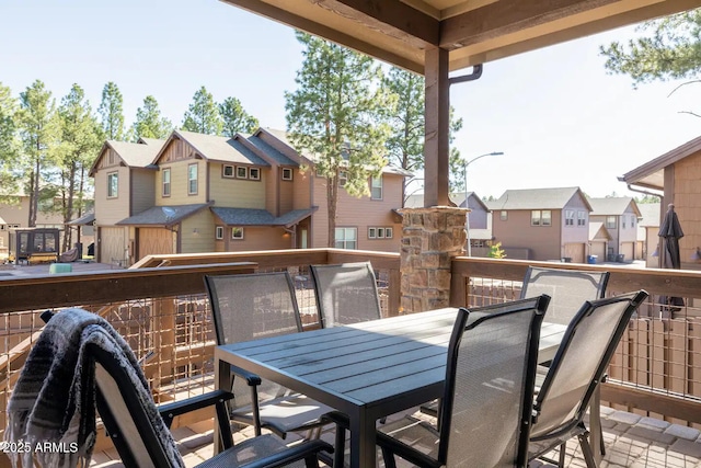2465 W Clement Cir, Flagstaff, AZ 86001 - view of wooden balcony featuring outdoor dining area, a residential view, and a deck