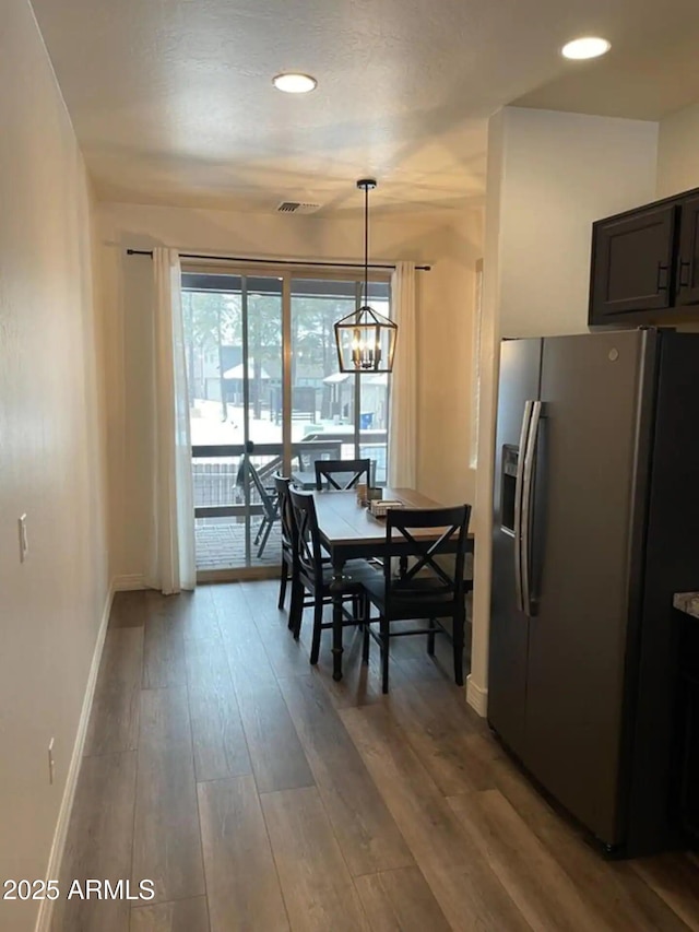 2465 W Clement Cir, Flagstaff, AZ 86001 - dining area with wood finished floors, baseboards, recessed lighting, and a chandelier