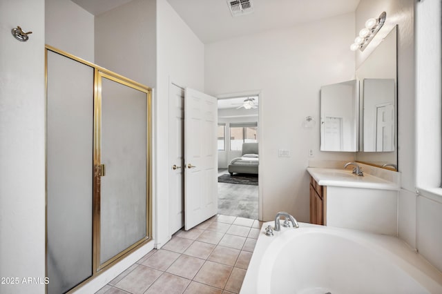 4414 W Monte Way, Laveen, AZ 85339 - bathroom featuring ensuite bathroom, vanity, a shower stall, a ceiling fan, and tile patterned flooring