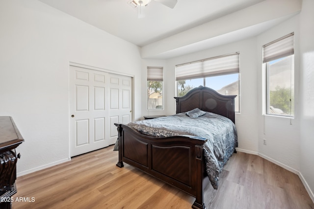 4414 W Monte Way, Laveen, AZ 85339 - bedroom with baseboards, light wood-style floors, a closet, and ceiling fan