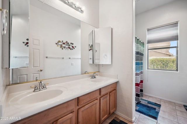 4414 W Monte Way, Laveen, AZ 85339 - full bath with double vanity, tile patterned floors, and baseboards