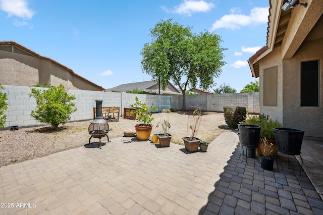4414 W Monte Way, Laveen, AZ 85339 - fenced backyard with a patio and an outdoor fire pit