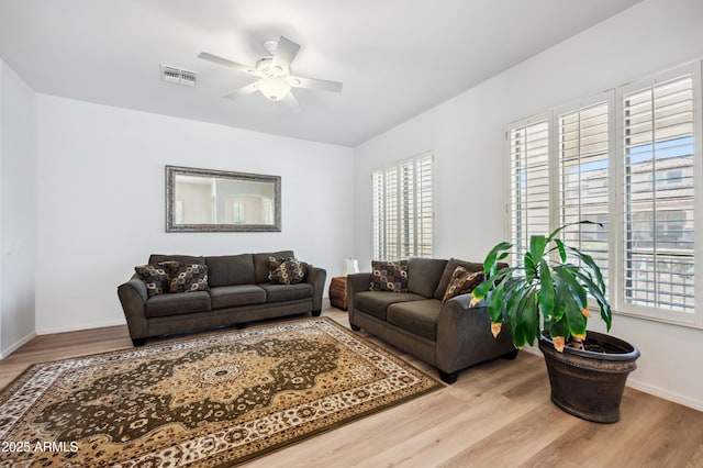 4414 W Monte Way, Laveen, AZ 85339 - living area with a ceiling fan, wood finished floors, and baseboards