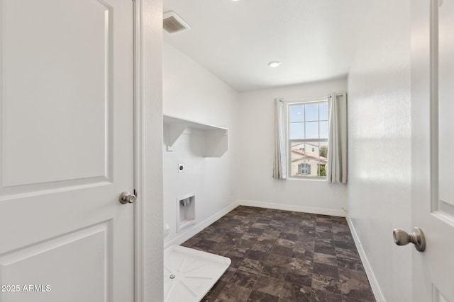 12531 W Glenn Dr, Glendale, AZ 85307 - laundry area with electric dryer hookup, stone finish floors, and baseboards