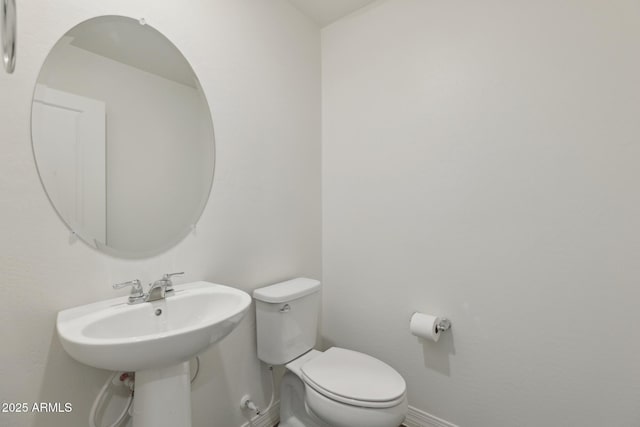 12531 W Glenn Dr, Glendale, AZ 85307 - bathroom featuring baseboards and toilet