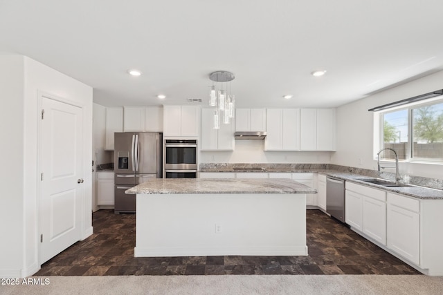 12531 W Glenn Dr, Glendale, AZ 85307 - kitchen with appliances with stainless steel finishes, a sink, a center island, under cabinet range hood, and recessed lighting