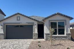 ranch-style home with driveway and an attached garage