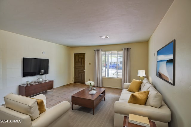 living room with light tile patterned floors