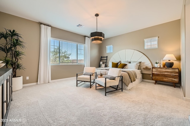 bedroom with visible vents, baseboards, and carpet