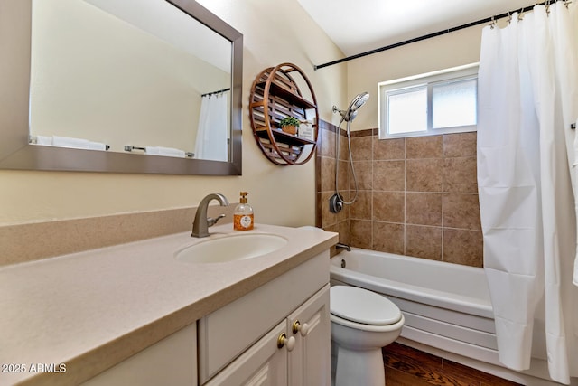 full bathroom featuring shower / bath combination with curtain, vanity, toilet, and wood finished floors