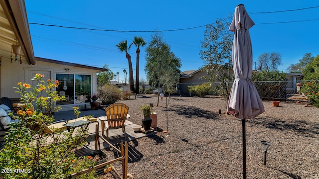 view of yard featuring a patio area and a fenced backyard