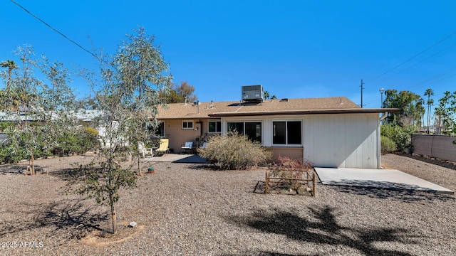 back of house featuring a fenced backyard, a patio, and central AC unit