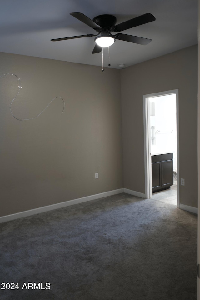 empty room with carpet floors and ceiling fan