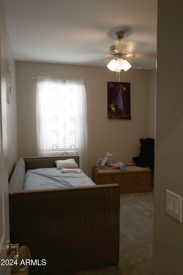 carpeted bedroom featuring ceiling fan