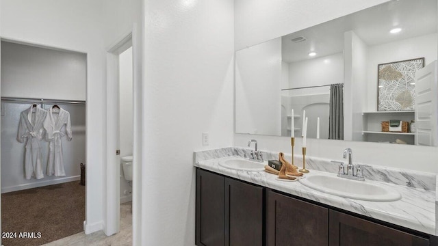 11890 E Cliffrose Ln, Florence, AZ 85132 - bathroom with double vanity and toilet