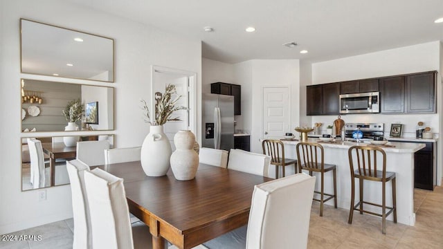 11890 E Cliffrose Ln, Florence, AZ 85132 - dining area with recessed lighting and light tile patterned floors
