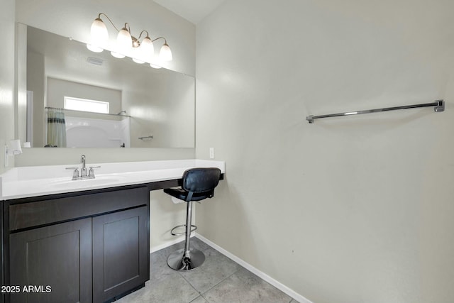 bathroom featuring a shower with shower curtain, baseboards, vanity, and tile patterned flooring