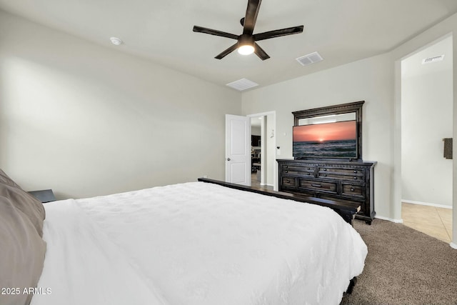 carpeted bedroom featuring visible vents, ceiling fan, and baseboards