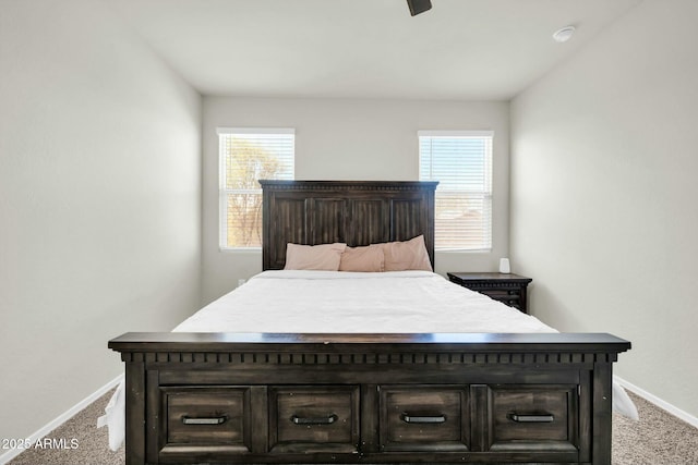 carpeted bedroom featuring baseboards