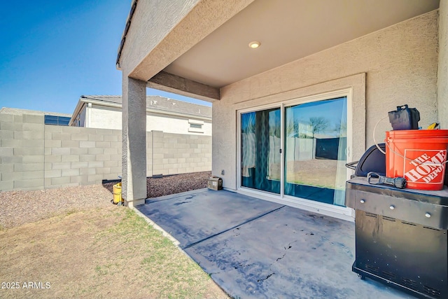 view of patio featuring fence