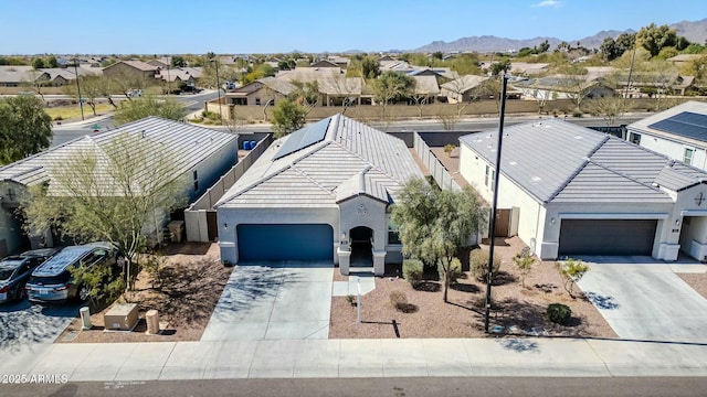 aerial view featuring a mountain view and a residential view