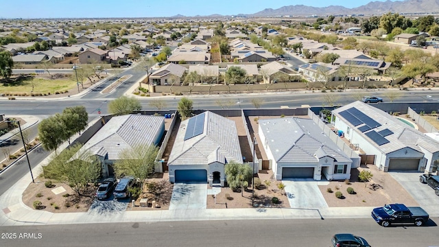 drone / aerial view featuring a mountain view and a residential view