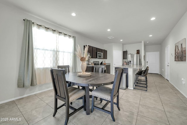 dining area with light tile patterned floors, recessed lighting, visible vents, and baseboards