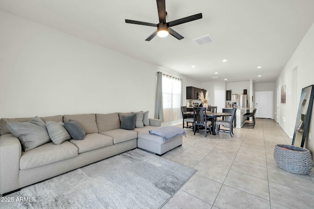 living room with light tile patterned floors, visible vents, recessed lighting, and a ceiling fan