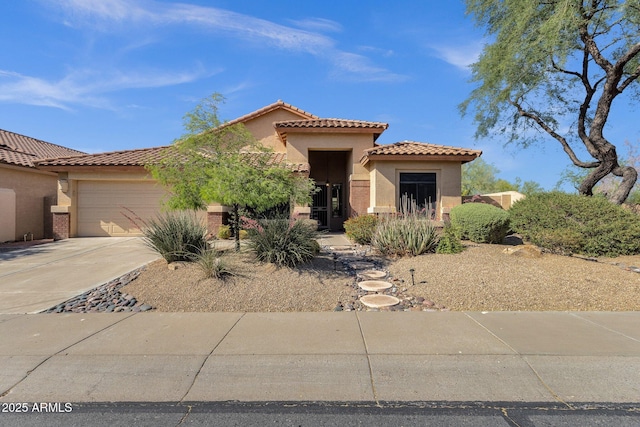 4338 E Hamblin Dr, Phoenix, AZ 85050 - mediterranean / spanish-style house with a garage, stucco siding, driveway, and a tiled roof