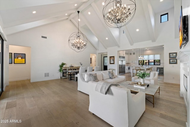 3808 E Fairmount Ave, Phoenix, AZ 85018 - living area featuring a chandelier, high vaulted ceiling, beam ceiling, light wood-style floors, and recessed lighting