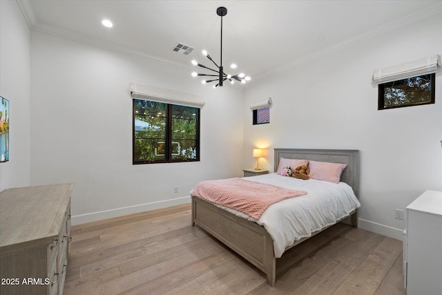 3808 E Fairmount Ave, Phoenix, AZ 85018 - bedroom with crown molding, light wood finished floors, a chandelier, and recessed lighting