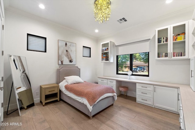 3808 E Fairmount Ave, Phoenix, AZ 85018 - bedroom featuring built in desk, light wood-style flooring, crown molding, recessed lighting, and a chandelier