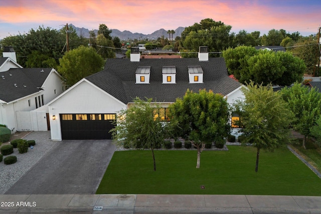 3808 E Fairmount Ave, Phoenix, AZ 85018 - modern farmhouse style home featuring an attached garage, concrete driveway, a front yard, a mountain view, and a chimney
