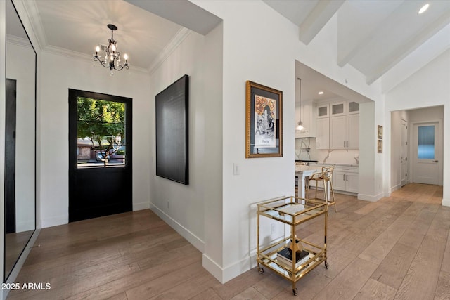 3808 E Fairmount Ave, Phoenix, AZ 85018 - entrance foyer featuring a chandelier, light wood-type flooring, ornamental molding, and recessed lighting