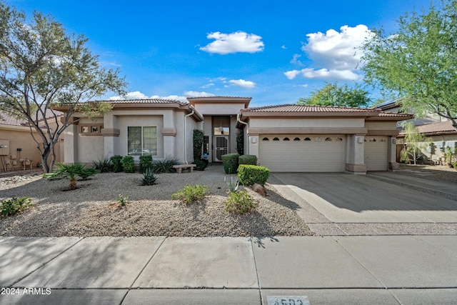 view of front of property with a garage