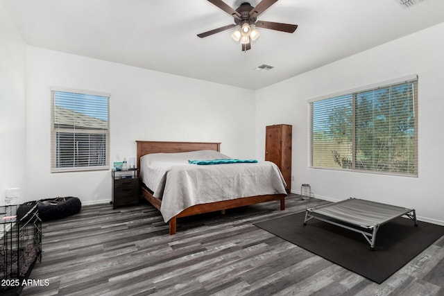 bedroom featuring dark wood-type flooring and ceiling fan