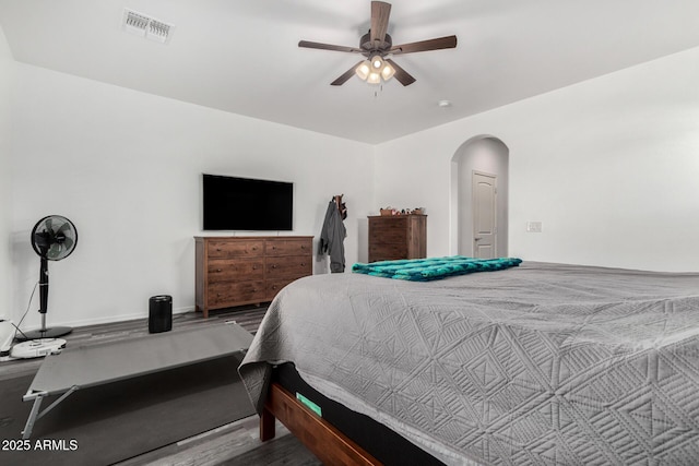 bedroom with hardwood / wood-style flooring and ceiling fan