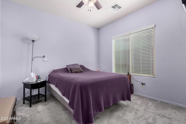 bedroom featuring light carpet and ceiling fan