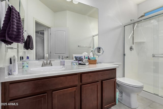 bathroom featuring walk in shower, tile patterned floors, toilet, and vanity