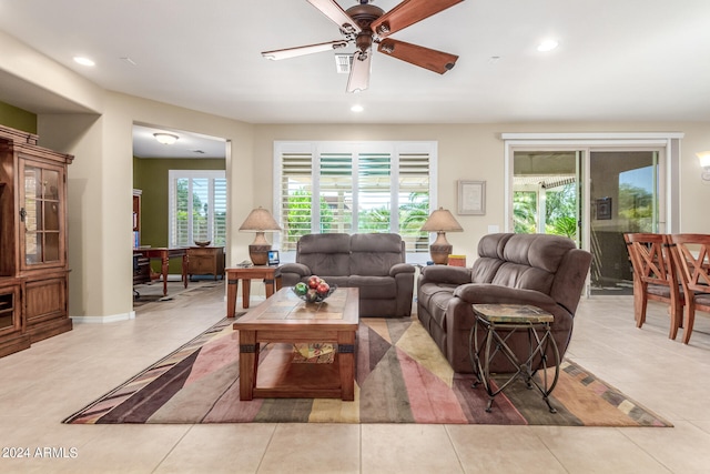 living room featuring light tile patterned flooring and ceiling fan