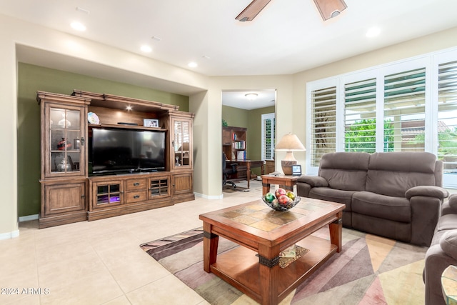 living room featuring ceiling fan and light tile patterned floors