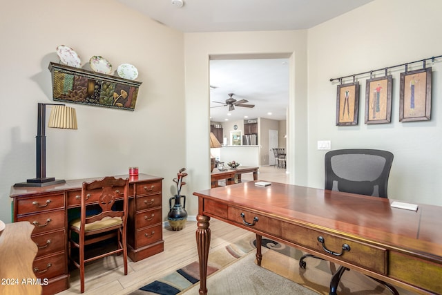 office space featuring ceiling fan and light hardwood / wood-style flooring