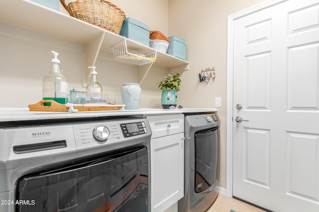 washroom featuring light tile patterned flooring and separate washer and dryer