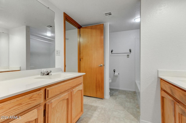 full bathroom with tile patterned floors, vanity, toilet, and shower / washtub combination