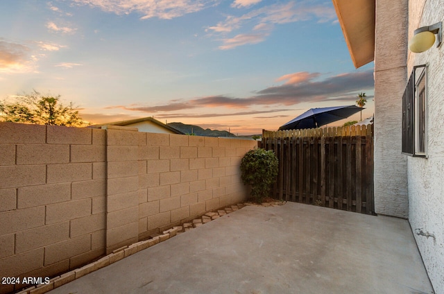 view of patio terrace at dusk