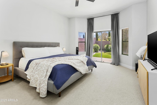 bedroom with ceiling fan, access to exterior, baseboards, and light carpet